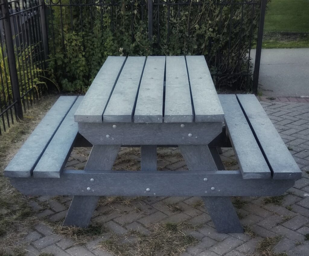 Picnic tables using plastic lumber